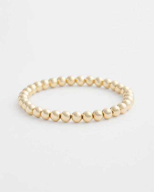 Small Beaded Gold Tone Stretch Bracelet - US 7468